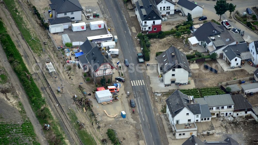 Dernau from the bird's eye view: Train station in Dernau after the flood disaster in the Ahr valley this year in the state Rhineland-Palatinate, Germany. The station serves as a location for various aid organizations as well as the tool distribution center