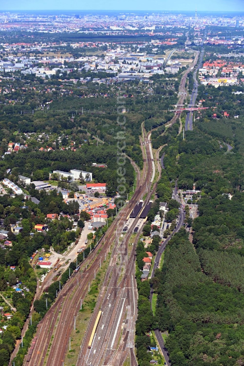 Aerial image Berlin - Station building and track systems of the S-Bahn station in the district Gruenau in Berlin, Germany