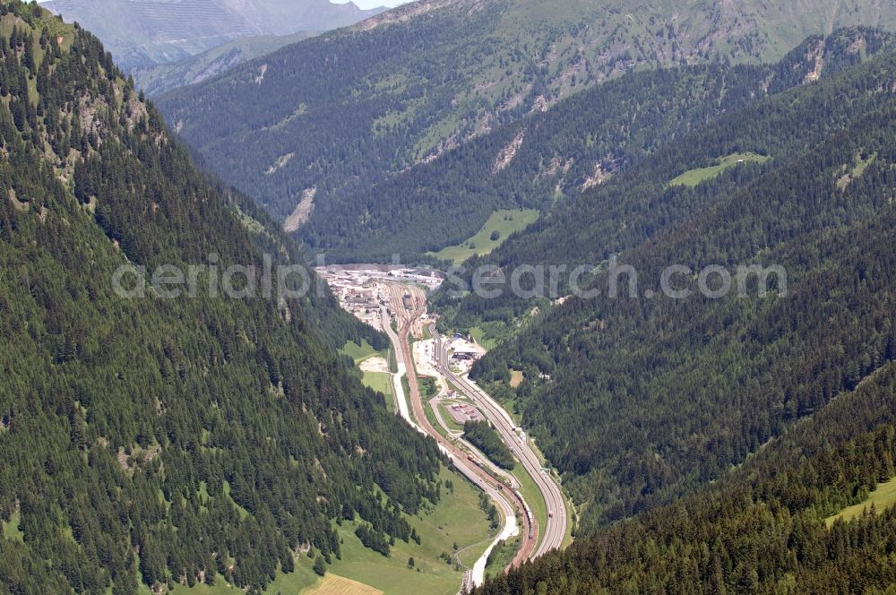 Aerial image Brennero - The Brenner train station not far from the Brennersee near the village Gries Brenner in Tirol in Austria. The Brenner highway is walking alongside the rails. Immediately at the station are residential and commercial spaces