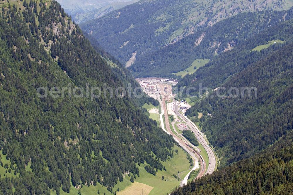 Aerial photograph Brennero - The Brenner train station not far from the Brennersee near the village Gries Brenner in Tirol in Austria. The Brenner highway is walking alongside the rails. Immediately at the station are residential and commercial spaces