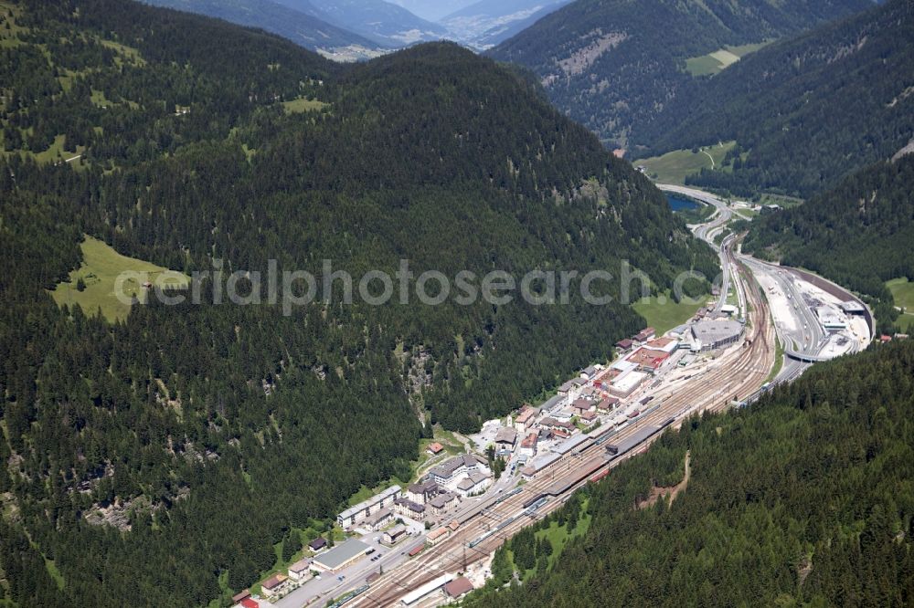 Brennero from above - The Brenner train station not far from the Brennersee near the village Gries Brenner in Tirol in Austria. The Brenner highway is walking alongside the rails. Immediately at the station are residential and commercial spaces
