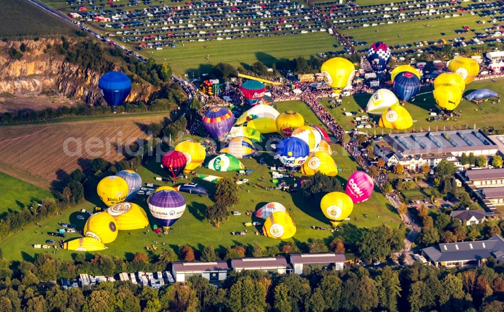 Aerial image Warstein - Hot air balloons at balloon festival Warsteiner Internationale Montgolfiade flying over the airspace in Warstein in the state North Rhine-Westphalia, Germany