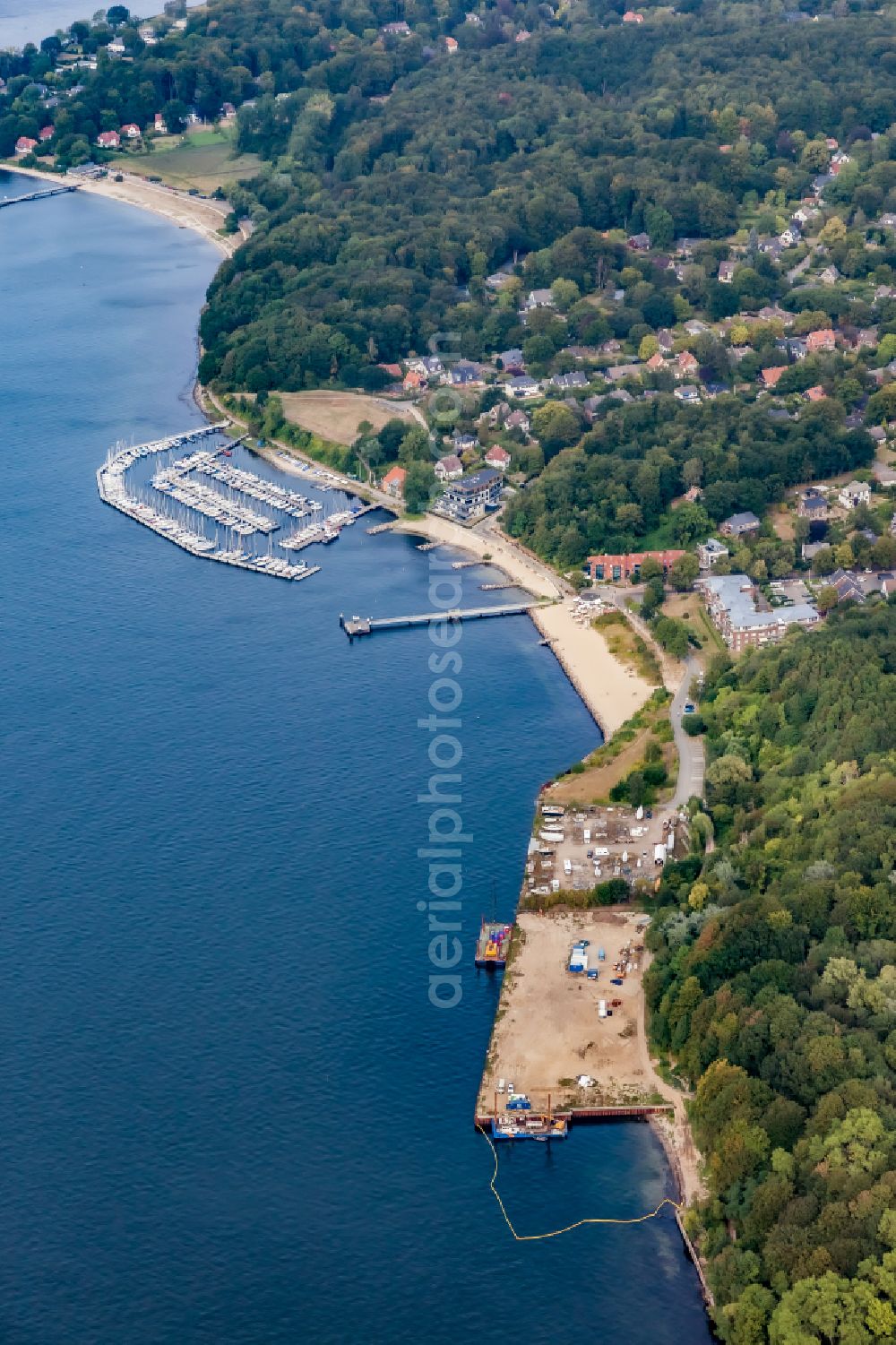 Mönkeberg from the bird's eye view: Construction work for the redevelopment on the former oil pier site on the Oelberg on the Kiel Fjord in Moenkeberg in the state Schleswig-Holstein, Germany