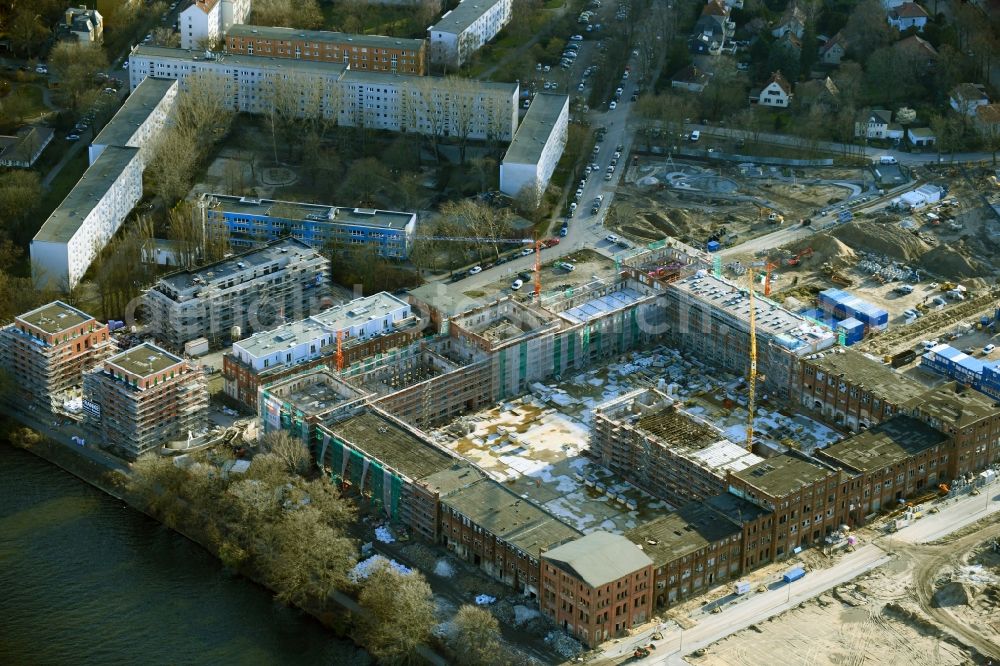Aerial photograph Berlin - Reconstruction and expansion - construction site of the buildings and halls of the old REWATEX laundry in the district of Spindlersfeld in Berlin, Germany. The Kanton Property development company mbH is building new apartments on the site with the Wasserstadt Spindlersfeld on the listed area