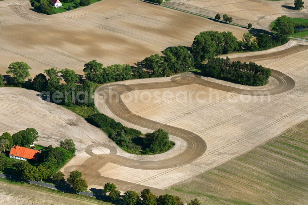 Philippshof from above - Island of trees in a harvested field in Philippshof in the state Mecklenburg - Western Pomerania, Germany