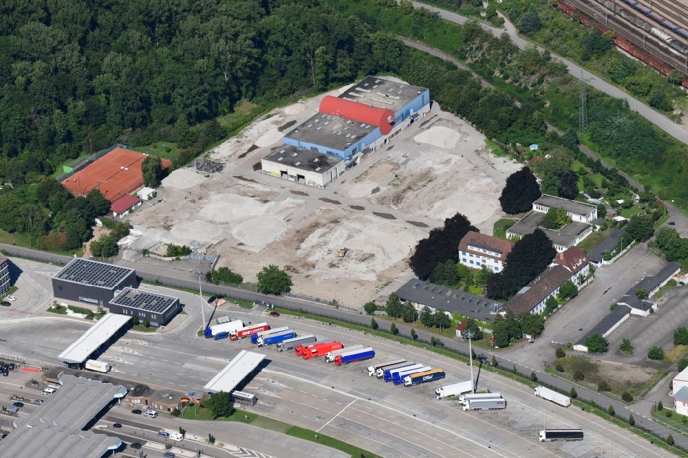 Weil am Rhein from the bird's eye view: Demolition and dismantling of buildings on the former factory grounds of foil manufacturer Lofo at the motorway border control Germany / Switzerland in Weil am Rhein in the state Baden-Wurttemberg, Germany