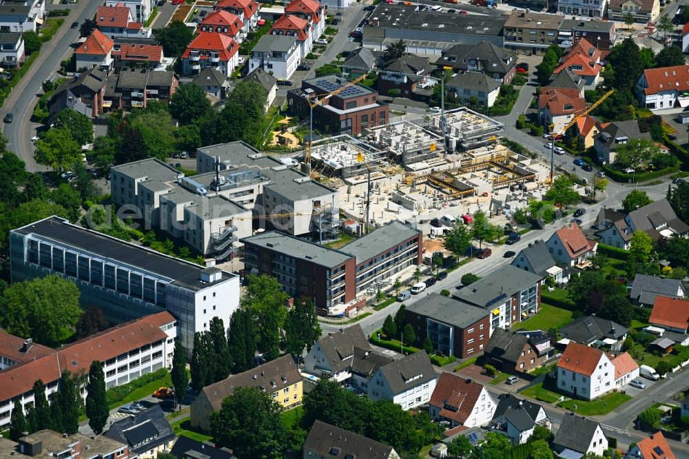 Aerial photograph Rheda - Construction site from the construction of a senior and age-appropriate residential complex Seniorenzentrum St. Elisabeth in Rheda in the state North Rhine-Westphalia, Germany