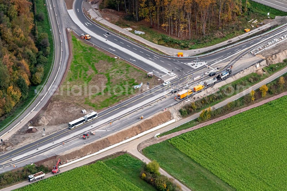 Ringsheim from the bird's eye view: Construction site for the new building of Routing and traffic lanes over the highway bridge in the motorway A A5 Ausfahrt Rust Ringsheim in Ringsheim in the state Baden-Wurttemberg, Germany