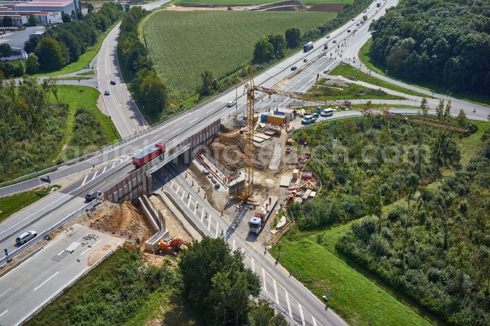 Ippesheim from above - Construction site for the new building of Routing and traffic lanes over the highway bridge in the motorway A in Ippesheim in the state Bavaria, Germany