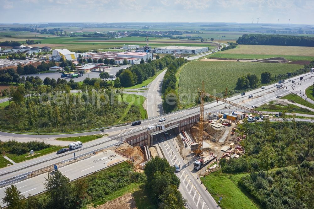 Ippesheim from the bird's eye view: Construction site for the new building of Routing and traffic lanes over the highway bridge in the motorway A in Ippesheim in the state Bavaria, Germany