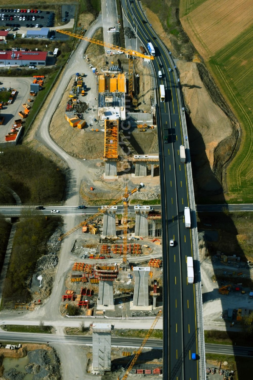 Aerial image Kürnach - Construction site for the new building of Routing and traffic lanes over the highway bridge Kuernachtalbruecke in the motorway A 7 in Kuernach in the state Bavaria, Germany