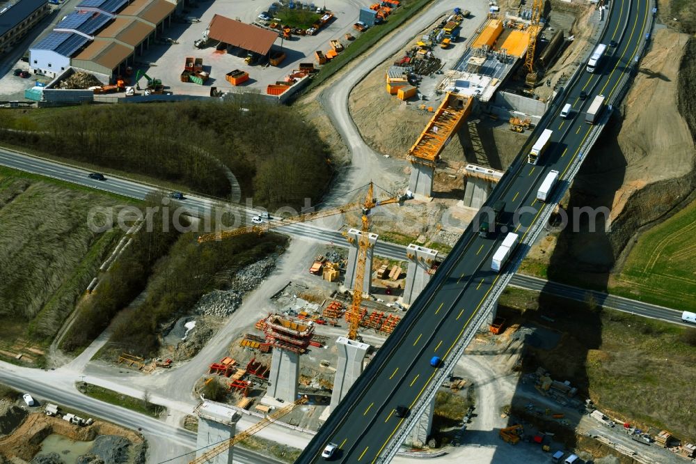 Kürnach from above - Construction site for the new building of Routing and traffic lanes over the highway bridge Kuernachtalbruecke in the motorway A 7 in Kuernach in the state Bavaria, Germany