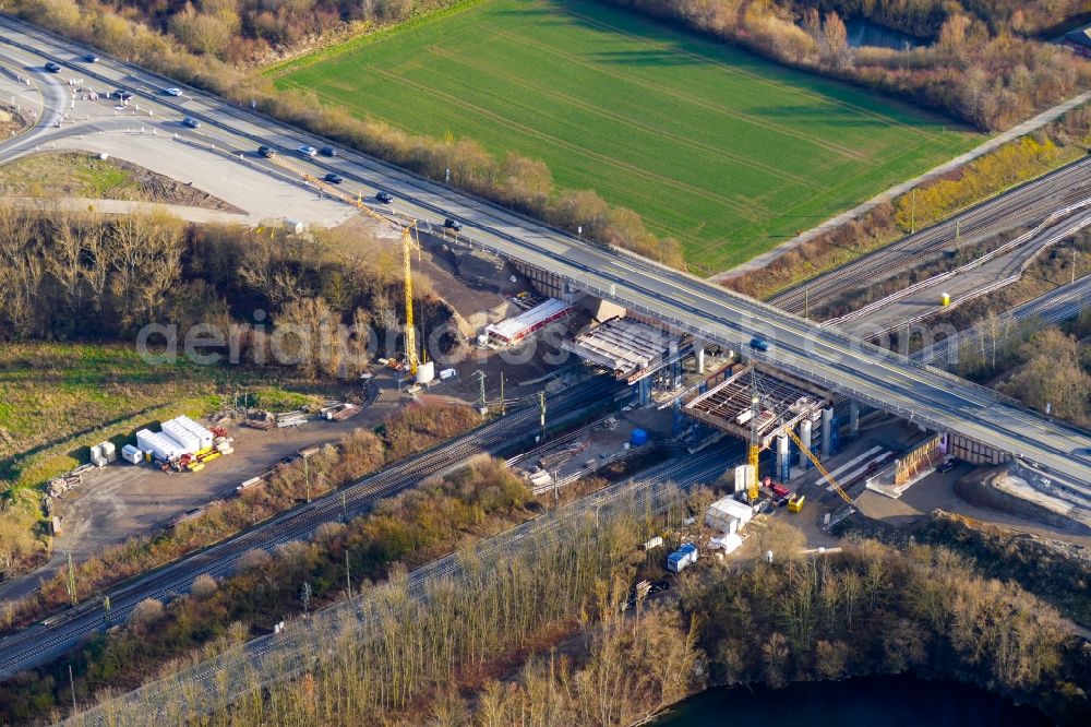 Northeim from the bird's eye view: Construction site for the new building of Routing and traffic lanes over the highway bridge in the motorway A 7 in Northeim in the state Lower Saxony, Germany