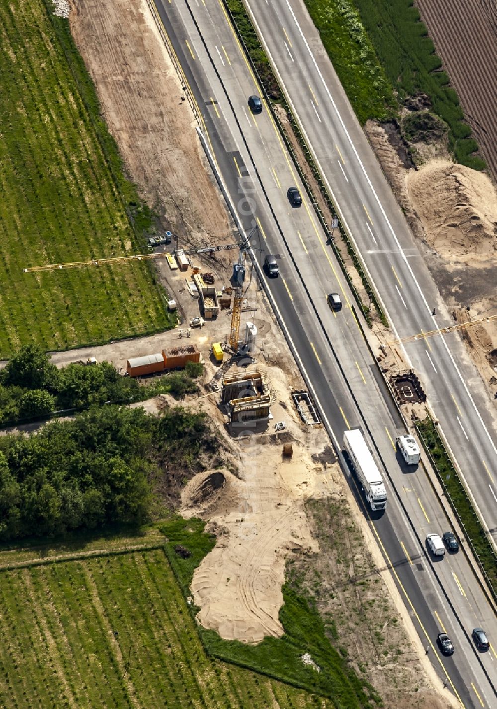 Aerial photograph Padenstedt - Construction site for the new building of Routing and traffic lanes over the highway bridge in the motorway A 7 in Padenstedt in the state Schleswig-Holstein, Germany