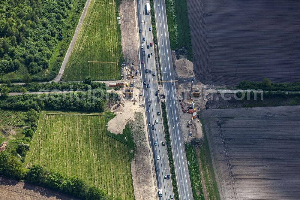 Aerial image Padenstedt - Construction site for the new building of Routing and traffic lanes over the highway bridge in the motorway A 7 in Padenstedt in the state Schleswig-Holstein, Germany