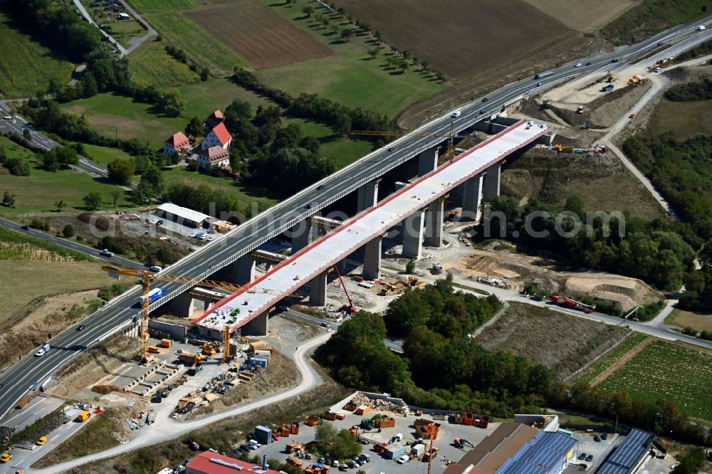 Aerial photograph Kürnach - Construction site for the new building of Routing and traffic lanes over the highway bridge in the motorway A 7 of Talbruecke Kuernach in Kuernach in the state Bavaria, Germany