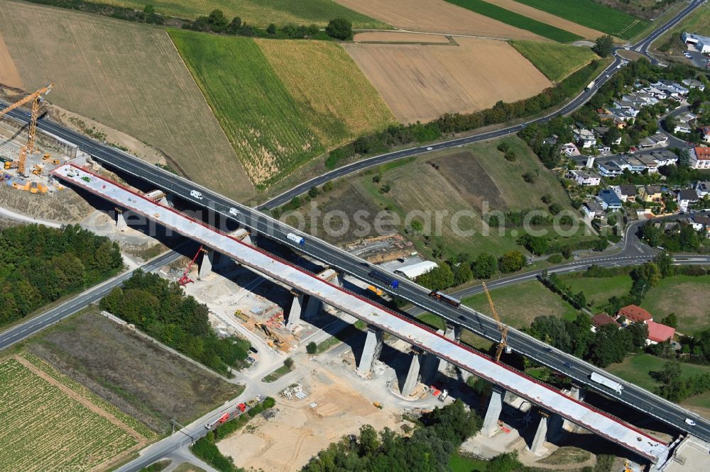 Aerial photograph Kürnach - Construction site for the new building of Routing and traffic lanes over the highway bridge in the motorway A 7 of Talbruecke Kuernach in Kuernach in the state Bavaria, Germany