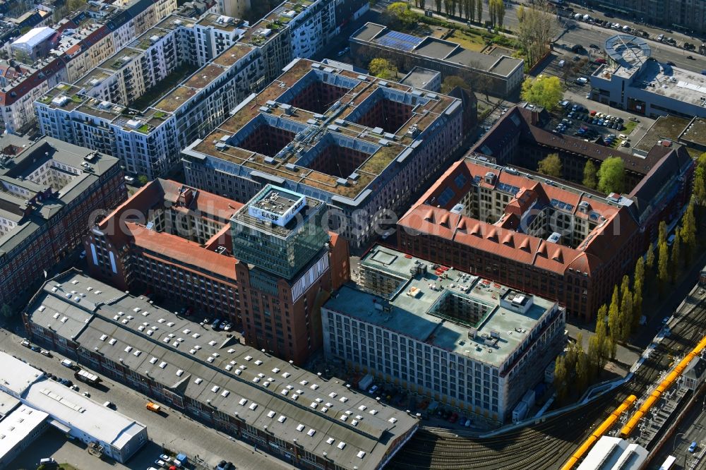 Aerial image Berlin - Construction site on building of the monument protected former Osram respectively Narva company premises Oberbaum City in the district Friedrichshain in Berlin. Here, among many other companies, BASF Services Europe, the German Post Customer Service Center GmbH and Heineken Germany GmbH are located. It is owned by HVB Immobilien AG, which is part of the UniCredit Group
