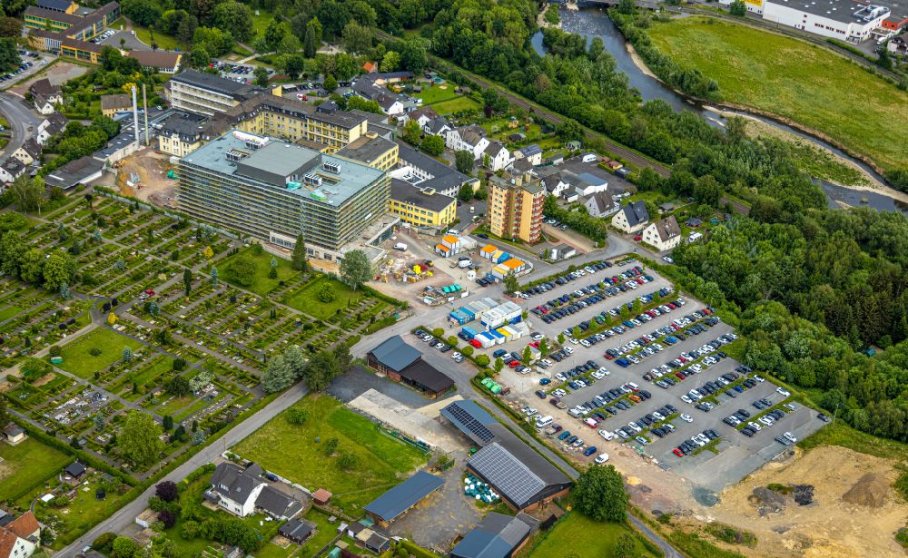 Aerial photograph Arnsberg - Construction site for a new extension to the hospital grounds Klinikum Hochsauerland - Karolinen-Hospital in the district Huesten in Arnsberg at Sauerland in the state North Rhine-Westphalia, Germany