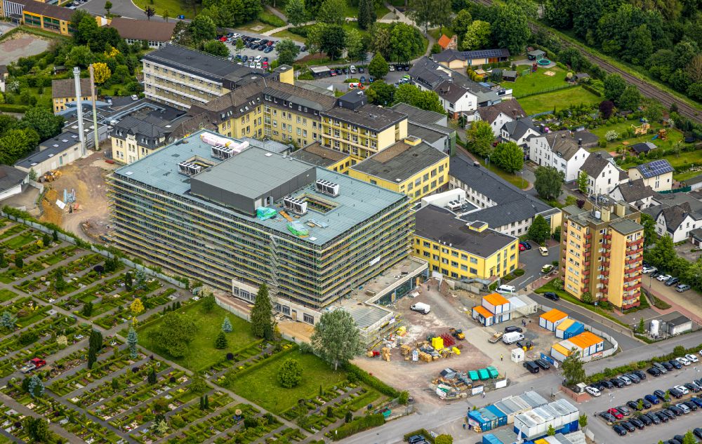 Arnsberg from above - Construction site for a new extension to the hospital grounds Klinikum Hochsauerland - Karolinen-Hospital in the district Huesten in Arnsberg at Sauerland in the state North Rhine-Westphalia, Germany