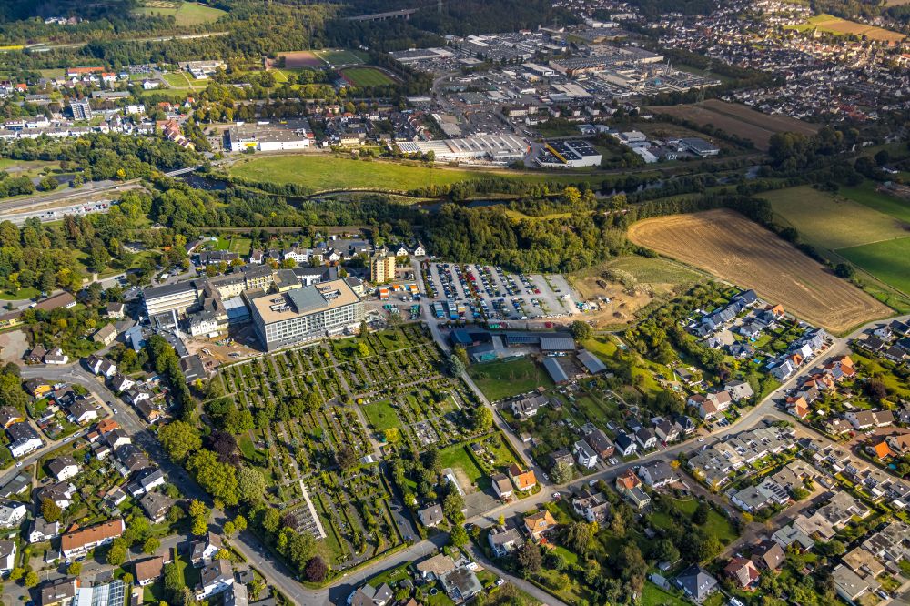 Arnsberg from the bird's eye view: Construction site for a new extension to the hospital grounds Klinikum Hochsauerland - Karolinen-Hospital in the district Huesten in Arnsberg at Sauerland in the state North Rhine-Westphalia, Germany