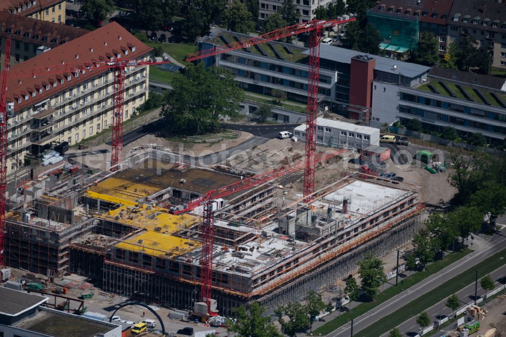 Aerial photograph Freiburg im Breisgau - Construction site for a new extension to the hospital grounds Universitaetsklinikum Freiburg in the district Stuehlinger in Freiburg im Breisgau in the state Baden-Wurttemberg, Germany