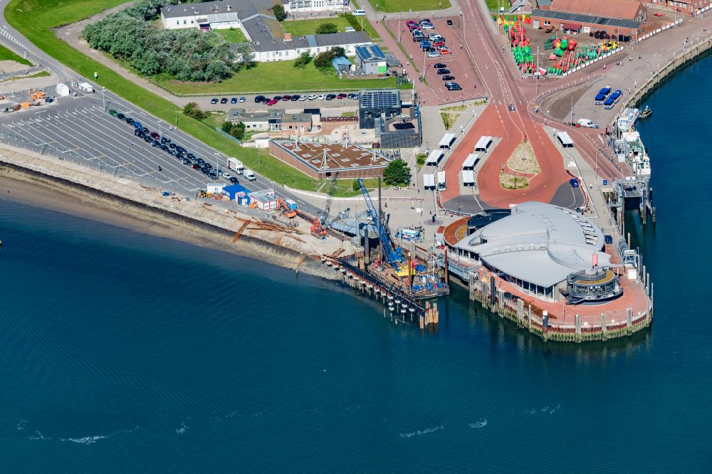 Norderney from the bird's eye view: Construction site for the renewal of the southern pier in the port of Norderney in the state of Lower Saxony, Germany
