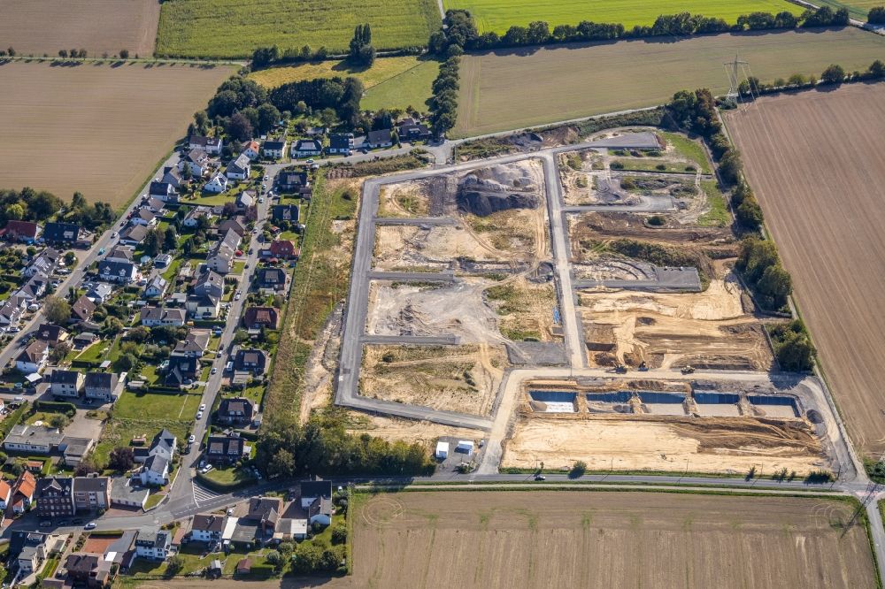 Holzwickede from the bird's eye view: Construction site with development works and embankments works at the new residential park Emscherquelle on the site of the former Emscher barracks in Holzwickede in the state North Rhine-Westphalia, Germany