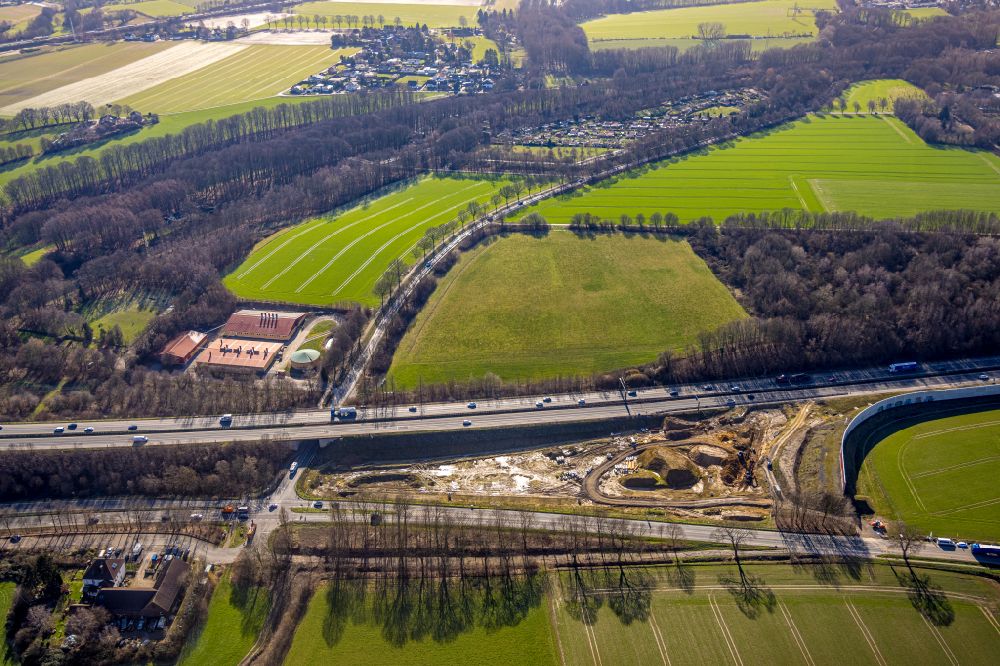 Holzwickede from the bird's eye view: Construction site with development works and embankments works on street Chaussee in Holzwickede at Ruhrgebiet in the state North Rhine-Westphalia, Germany