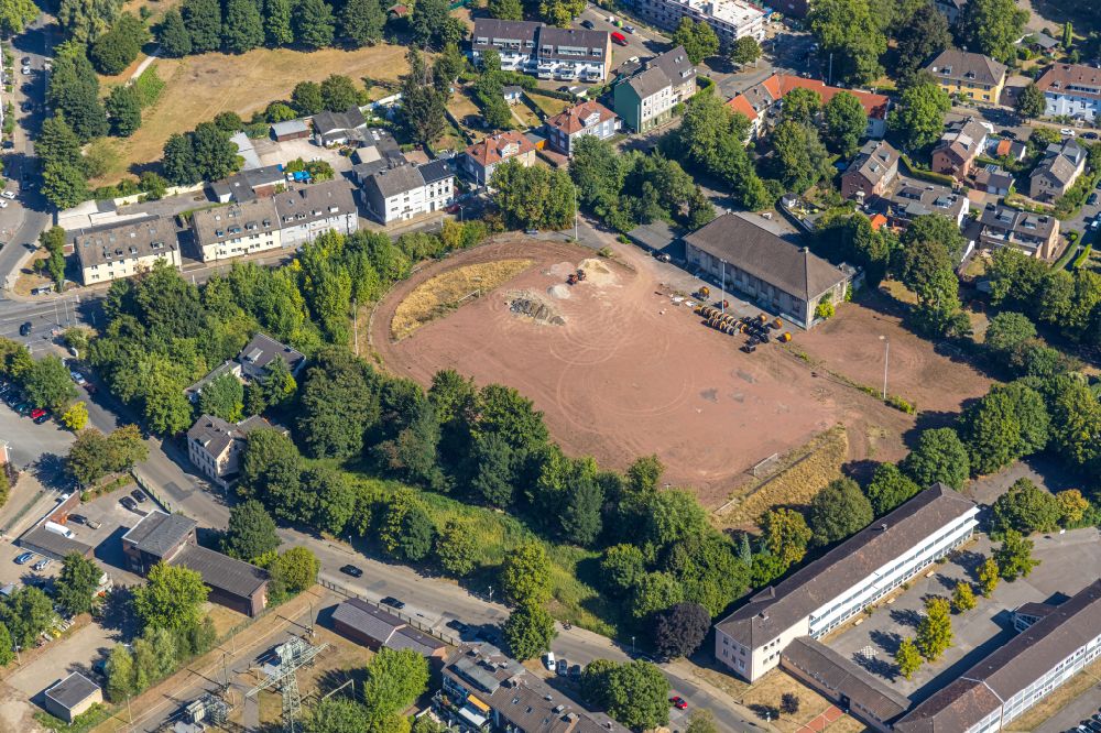 Essen from above - Construction site with development works and embankments works for the new city quarter Quartier der Generationen with swimming pool - indoor swimming pool in the district Bochold in Essen at Ruhrgebiet in the state North Rhine-Westphalia, Germany