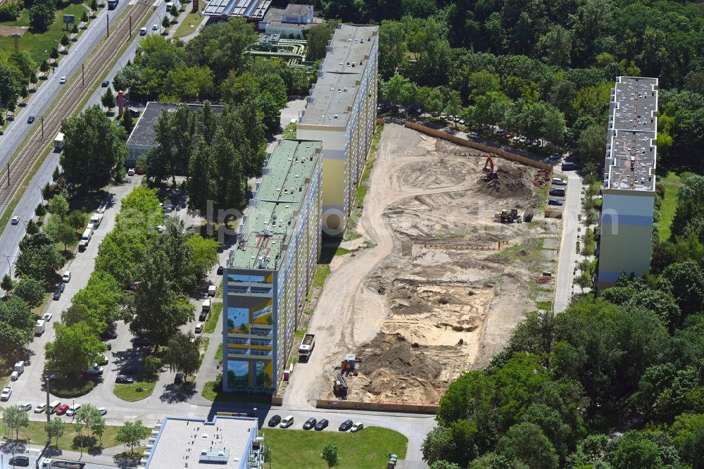 Berlin from the bird's eye view: Construction site with development, foundation, earth and landfill works on street Rhinstrasse in the district Friedrichsfelde in Berlin, Germany
