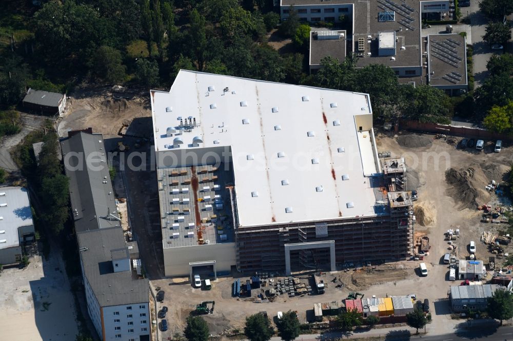 Berlin from the bird's eye view: Demolition site of the ruins of the factory building of the former BaerenSiegel distillery on Adlergestell in Adlershof, Berlin. At the construction site of the distinctive production building GDR times development a shopping center