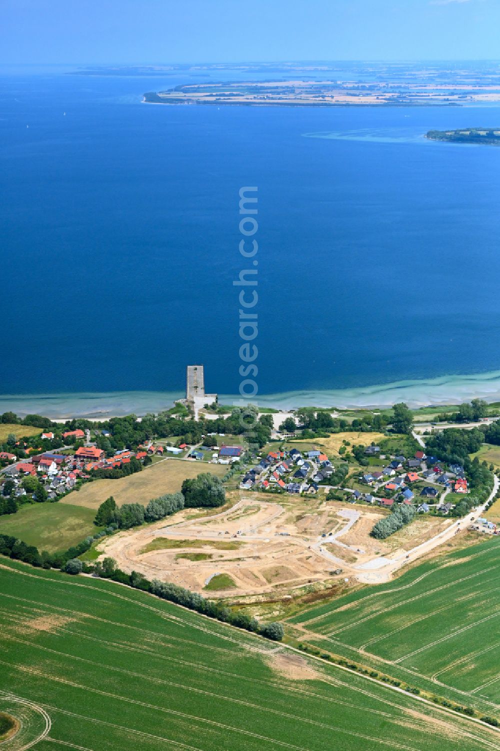 Wohlenberg from the bird's eye view: Construction site for the construction of a new apartment building used for holiday apartments on the Ostseeblick street in Wohlenberg in the state Mecklenburg-Western Pomerania, Germany
