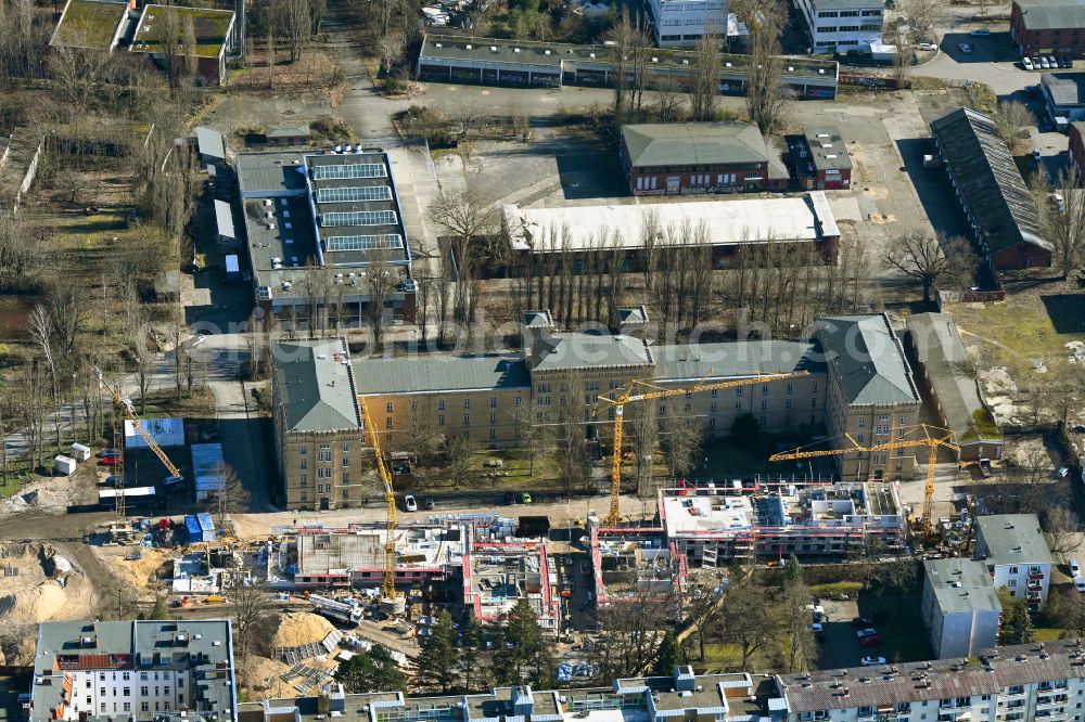Berlin from the bird's eye view: Construction site for the new building of Asylum accommodation buildings on street Schoenwalder Strasse - Askanierring in the district Spandau in Berlin, Germany