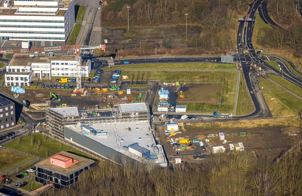Bochum from above - Construction site of the Innovation Center for Healthcare of Kampmann Hoersysteme GmbH and contec - Gesellschaft fuer Organizationsentwicklung mbH on the health campus in the district of Bochum Sued in the district of Querenburg in Bochum in the Ruhr area in the state North Rhine-Westphalia, Germany