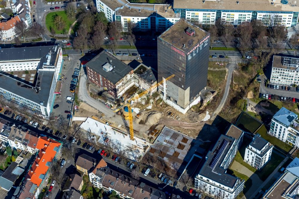 Dortmund from the bird's eye view: Construction site on the site of the industrial ruin Kronenturm of the former Kronen brewery for the construction of a residential building for rental apartments with underground parking on the Kronenstrasse in Dortmund in the state North Rhine-Westphalia, Germany