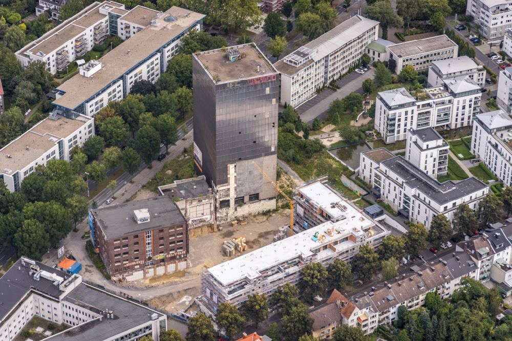 Aerial image Dortmund - Construction site on the site of the industrial ruin Kronenturm of the former Kronen brewery for the construction of a residential building for rental apartments with underground parking on the Kronenstrasse in Dortmund in the state North Rhine-Westphalia, Germany