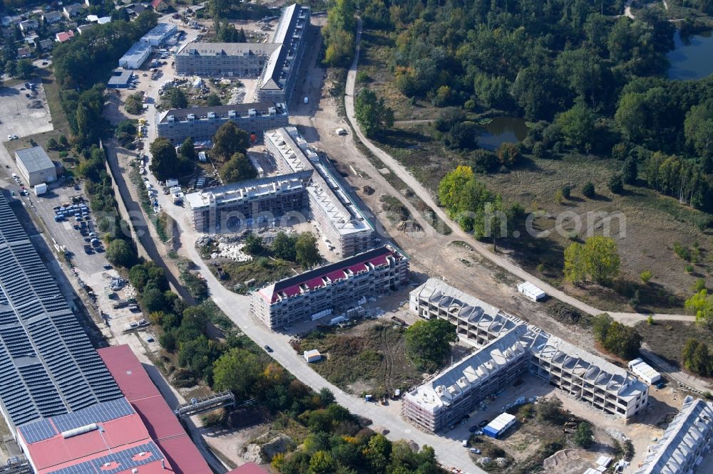 Bernau from the bird's eye view: Construction site for the renovation and reconstruction of the building complex of the former military barracks redevelopment area Panke-Park on Schoenfelder Weg in Bernau in the state Brandenburg, Germany