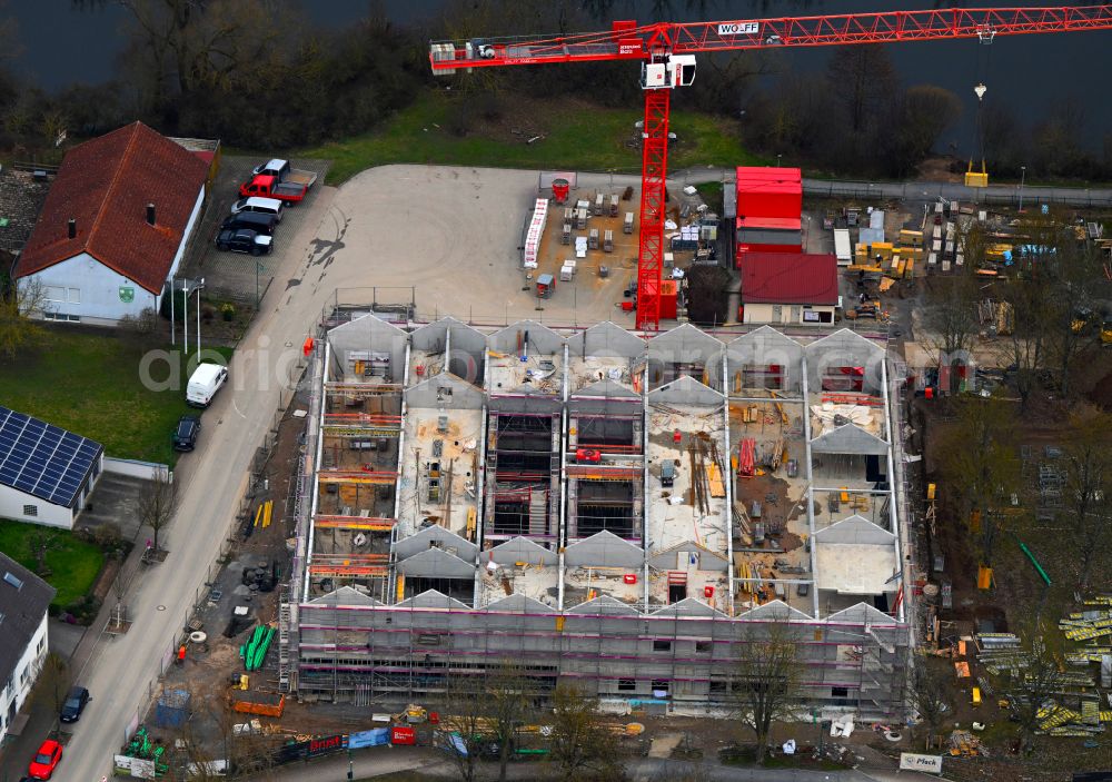 Grafenrheinfeld from the bird's eye view: New construction site for the construction of a kindergarten building and Nursery school and comprehensive daycare center on street Am Wehrbusch in Grafenrheinfeld in the state Bavaria, Germany
