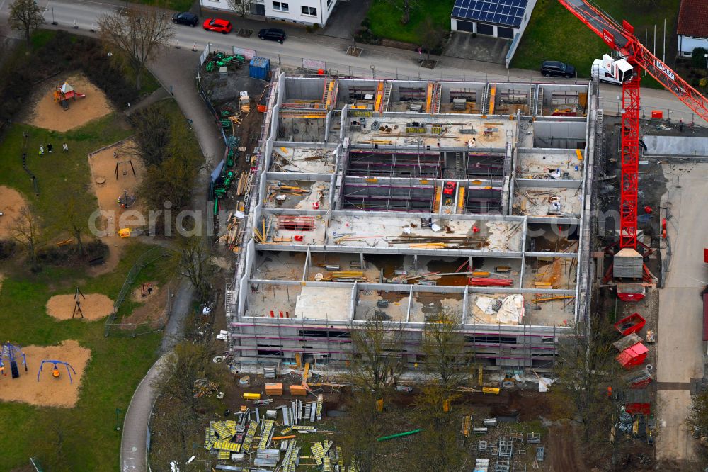 Aerial image Grafenrheinfeld - New construction site for the construction of a kindergarten building and Nursery school and comprehensive daycare center on street Am Wehrbusch in Grafenrheinfeld in the state Bavaria, Germany