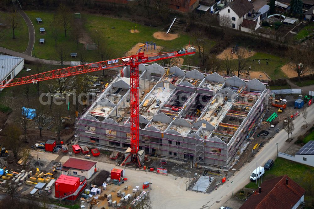 Aerial photograph Grafenrheinfeld - New construction site for the construction of a kindergarten building and Nursery school and comprehensive daycare center on street Am Wehrbusch in Grafenrheinfeld in the state Bavaria, Germany