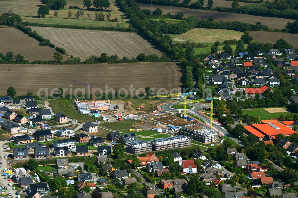Aerial photograph Escheburg - Residential area construction site of a mixed development with multi-family houses and single-family houses- New building at the on street Lange Stuecken in Escheburg in the state Schleswig-Holstein, Germany