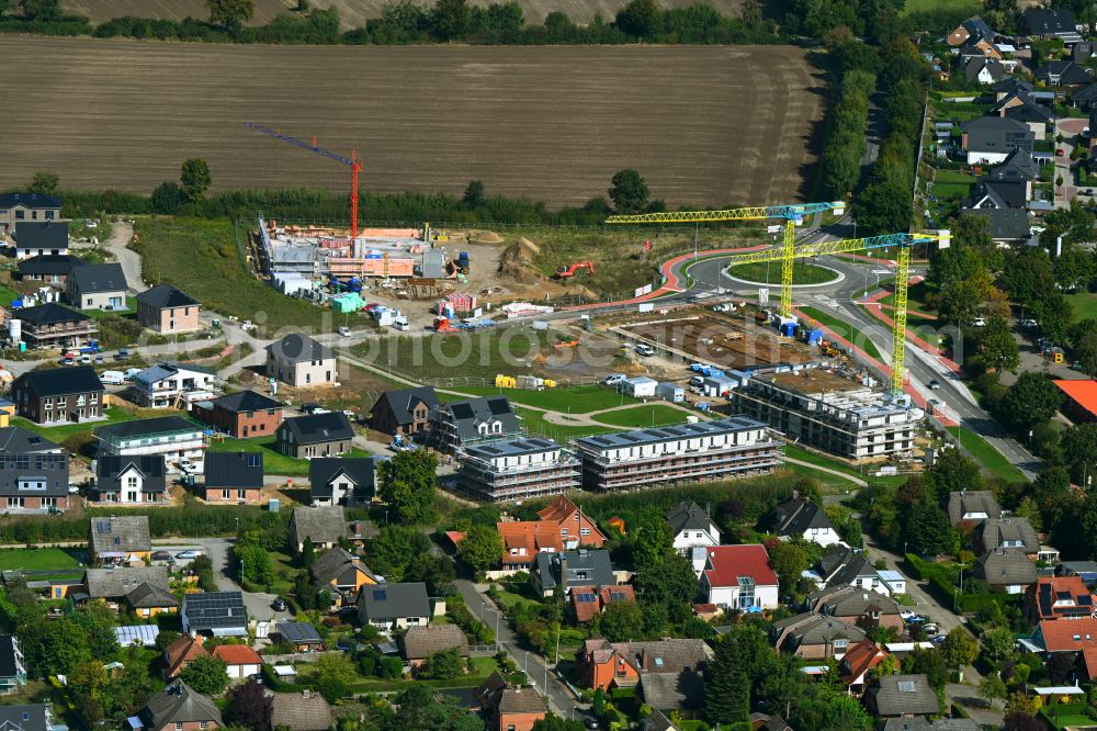 Escheburg from above - Residential area construction site of a mixed development with multi-family houses and single-family houses- New building at the on street Lange Stuecken in Escheburg in the state Schleswig-Holstein, Germany
