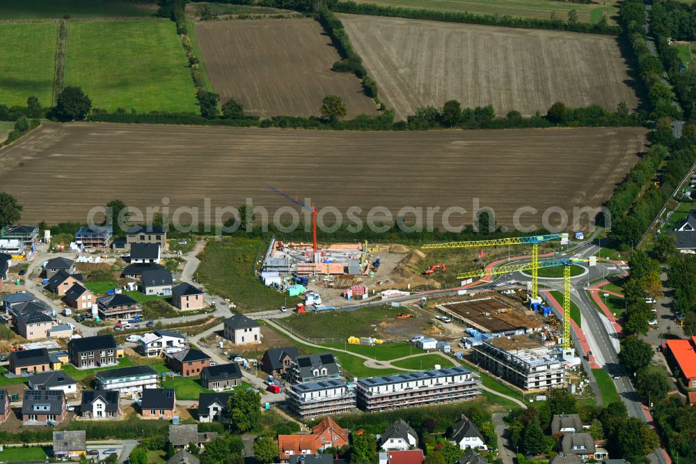 Escheburg from the bird's eye view: Residential area construction site of a mixed development with multi-family houses and single-family houses- New building at the on street Lange Stuecken in Escheburg in the state Schleswig-Holstein, Germany