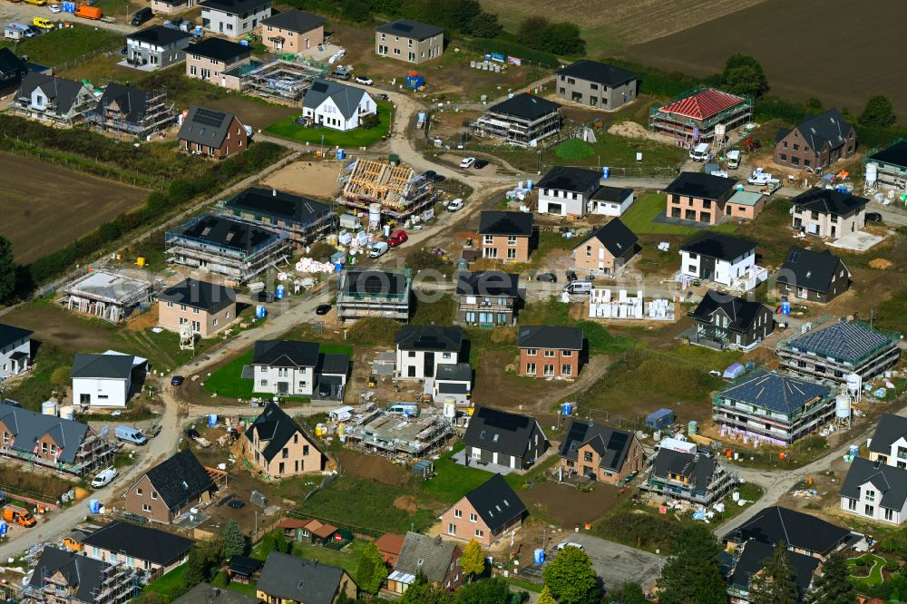 Aerial image Escheburg - Residential area construction site of a mixed development with multi-family houses and single-family houses- New building at the on street Lange Stuecken in Escheburg in the state Schleswig-Holstein, Germany