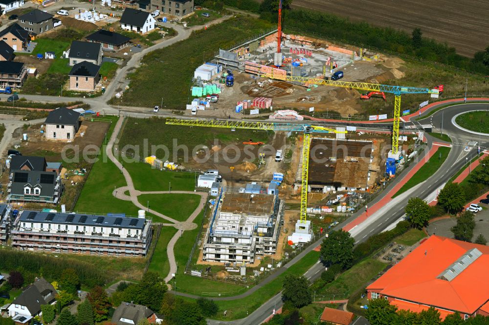 Aerial photograph Escheburg - Residential area construction site of a mixed development with multi-family houses and single-family houses- New building at the on street Lange Stuecken in Escheburg in the state Schleswig-Holstein, Germany