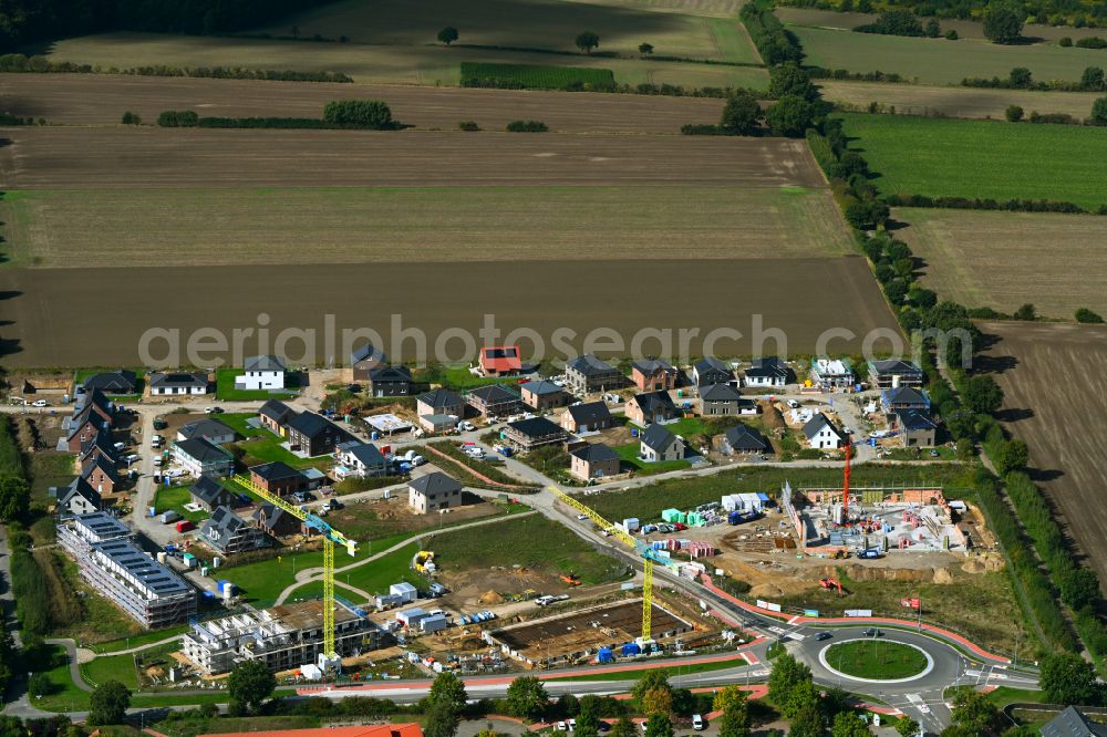 Escheburg from above - Residential area construction site of a mixed development with multi-family houses and single-family houses- New building at the on street Lange Stuecken in Escheburg in the state Schleswig-Holstein, Germany
