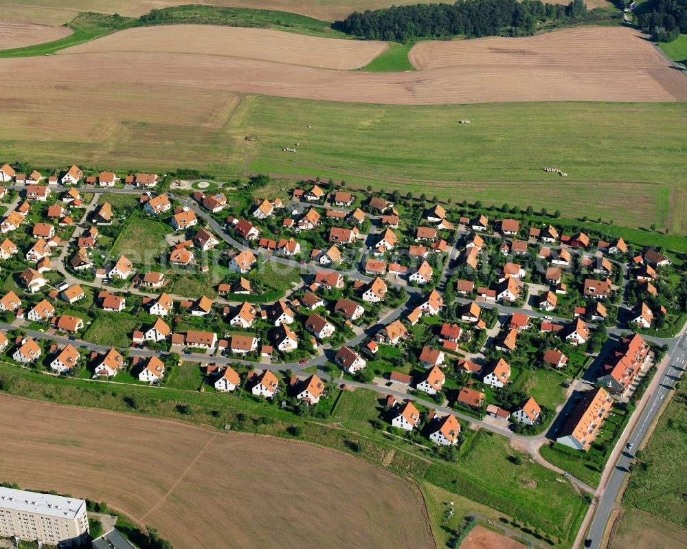Aerial image Mühlbach - Residential area construction site of a mixed development with multi-family houses and single-family houses- New building at the in Mühlbach in the state Saxony, Germany