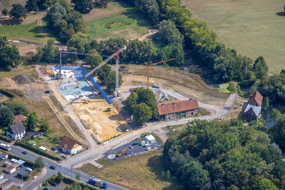 Aerial image Hamm - Residential area construction site of a mixed development with multi-family houses and single-family houses- New building at the castle mill and homestead - farm ruins at Muehlenteich in Hamm at Ruhrgebiet in the state North Rhine-Westphalia, Germany