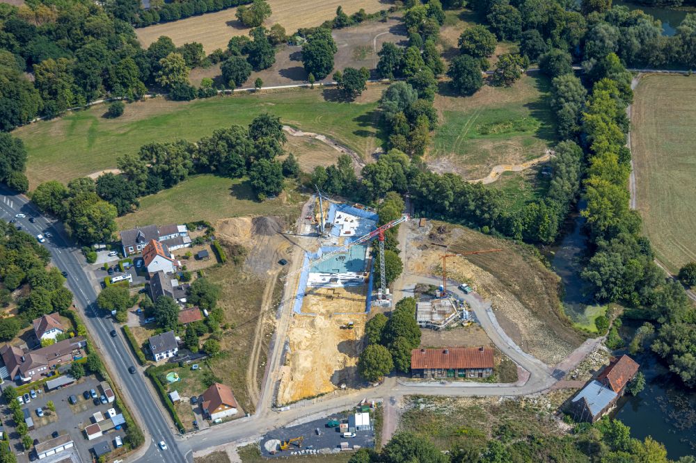Aerial photograph Hamm - Residential area construction site of a mixed development with multi-family houses and single-family houses- New building at the castle mill and homestead - farm ruins at Muehlenteich in Hamm at Ruhrgebiet in the state North Rhine-Westphalia, Germany